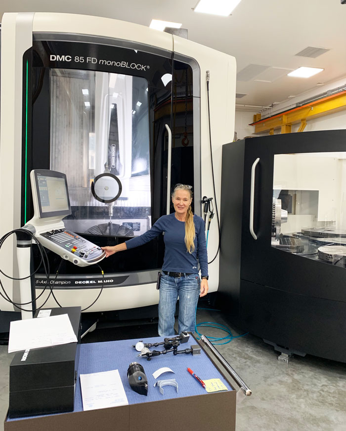 Ronda Peterson with Peterson Machining's latest quality 5 D Axis DMC 85 MonoBlock with pallet changer